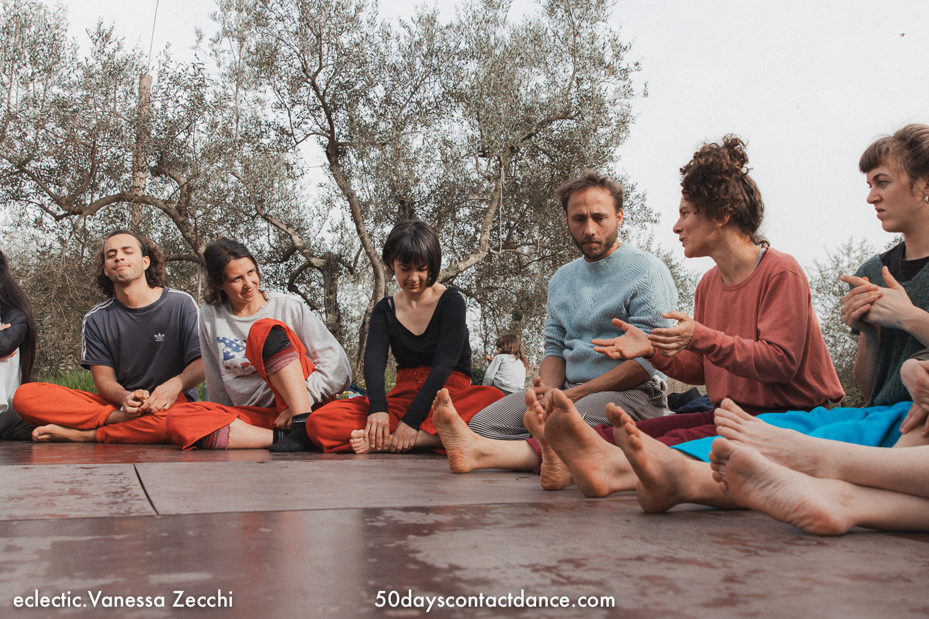 Contact dance improvisation workshop participants in a feedback session